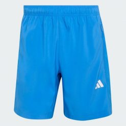 Tkane Szorty Do Ćwiczeń Essentials Base. Niebieskie szorty Adidas, bez wzorów, sportowe. Za 119.00 zł.