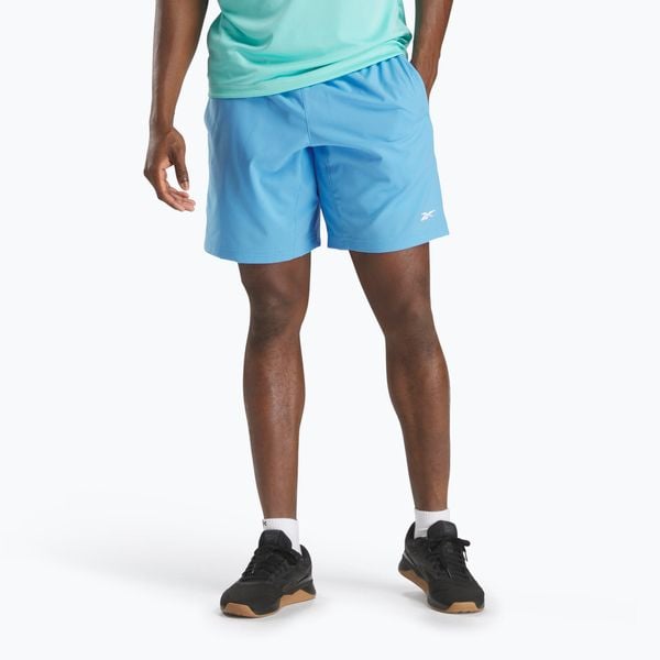 Spodenki Reebok Wor Woven. Niebieskie szorty REEBOK FITNESS, bez wzorów, sportowe. Za 109.99 zł.