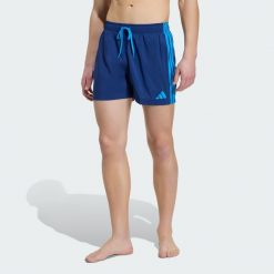 Szorty do pływania 3-Stripes. Niebieskie krótkie spodenki sportowe Adidas, l, bez wzorów, z materiału. Za 149.00 zł.
