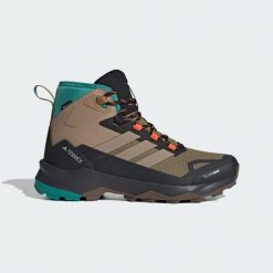 Buty trekkingowe Terrex Skychaser AX5 Mid GORE-TEX CLIMAWARM+. Brązowe trekkingi Adidas, bez wzorów, z gore-texu, bez zapięcia. Za 699.00 zł.