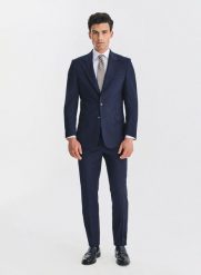 PAKO LORENTE - Wełniany granatowy garnitur męski. Niebieskie garnitury Pako Lorente, do pracy, m, bez wzorów, z wełny. Za 2,499.98 zł.