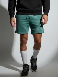 Luźne szorty wiązane w talii - zielony. Zielone krótkie spodenki sportowe Sinsay, l, bez wzorów. W wyprzedaży za 13.99 zł.