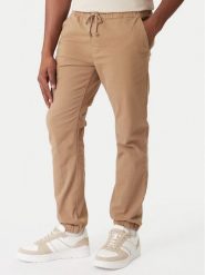 Tommy Jeans Joggery DM0DM23102 Brązowy Regular Fit. Brązowe joggery i bojówki Tommy Jeans, l, bez wzorów, z bawełny. Za 369.99 zł.