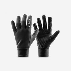Rękawiczki piłkarskie Kipsta Keepwarm. Czarne rękawiczki KIPSTA, bez wzorów, z materiału. W wyprzedaży za 39.99 zł.