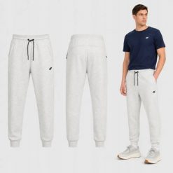 SPODNIE MĘSKIE 4F DRESOWE JOGGERY SPORTOWE SZARE. Szare joggery i bojówki 4F, m, bez wzorów, z bawełny, sportowe. Za 149.99 zł.