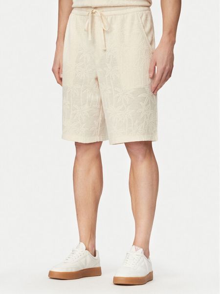 Guess Szorty sportowe F6GD03 kremKG362 Kremowy Regular Fit. Białe krótkie spodenki sportowe Guess, m, z aplikacjami, z syntetyku. Za 153.99 zł.
