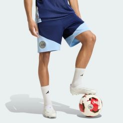 Spodenki treningowe Ajax Amsterdam 26/27 Tiro26. Niebieskie krótkie spodenki sportowe Adidas, l, bez wzorów, z materiału. Za 199.00 zł.