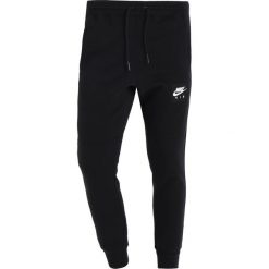 Nike Sportswear AIR JOGGER Spodnie treningowe black/white. Spodnie treningowe długie marki Nike Sportswear. Za 249.00 zł.