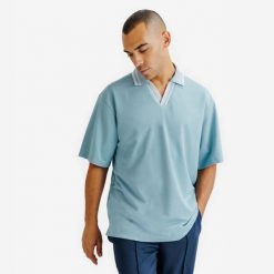 Koszulka polo oversize męska Heritage. Niebieskie koszulki polo Decathlon, bez wzorów, z materiału, bez ramiączek, na golfa. Za 89.99 zł.