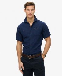 Superdry Koszula krótki rękaw The Merchant Store o fakturze. Niebieskie koszule Superdry, l, bez wzorów, z bawełny, bez kołnierzyka, bez ramiączek. Za 344.20 zł.