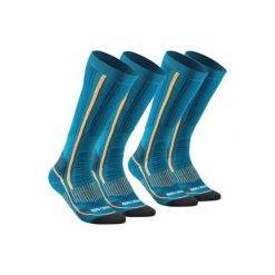 Skarpety turystyczne SH520 X-warm długie. Szare skarpety QUECHUA, bez wzorów, z elastanu. Za 79.99 zł.