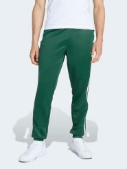 Adidas Spodnie dresowe w kolorze zielonym rozmiar: XL. Zielone spodnie treningowe długie Adidas, xl, bez wzorów, z dresówki. Za 184.95 zł.