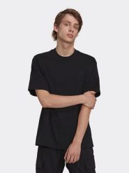 Adidas Koszulka w kolorze czarnym rozmiar: XS. Czarne bezrękawniki Adidas, xs, bez wzorów, z bawełny, bez kołnierzyka, bez ramiączek. Za 92.86 zł.