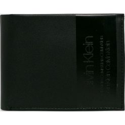 Calvin Klein - Portfel skórzany. Niebieskie portfele CALVIN KLEIN, bez wzorów, z materiału. W wyprzedaży za 219.90 zł.