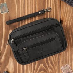 Saszetka męska czarna skórzana do ręki vintage Paolo Peruzzi T-130-HBL. Czarne torby na ramię bez wzorów, ze skóry, do ręki, bez dodatków. Za 129.00 zł.