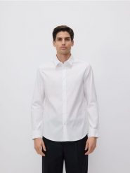 Bawełniana koszula slim fit - biały. Białe koszule Reserved, l, bez wzorów, z bawełny, bez kołnierzyka, bez ramiączek. W wyprzedaży za 119.99 zł.