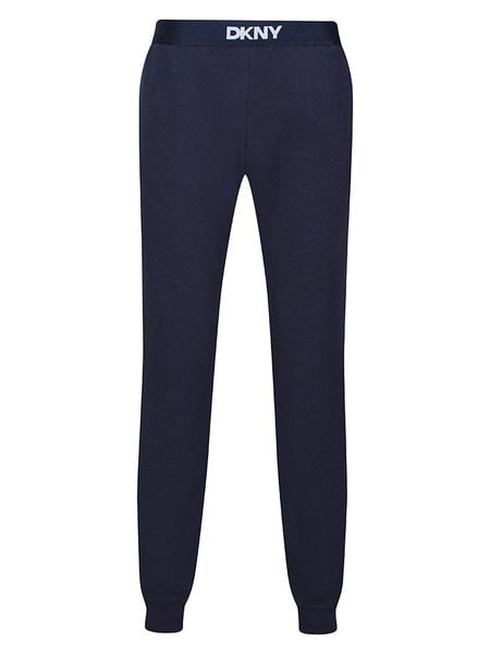 DKNY Spodnie dresowe w kolorze granatowym rozmiar: XL. Niebieskie spodnie treningowe długie DKNY, xl, bez wzorów, z bawełny. Za 113.63 zł.