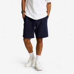 Spodenki fitness męskie Domyos. Niebieskie szorty DOMYOS, l, bez wzorów, z materiału, sportowe. Za 69.99 zł.