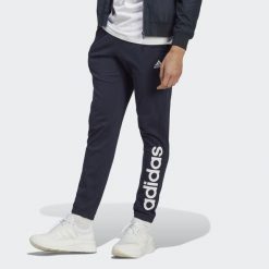 Spodnie dresowe męskie adidas Essentials Single Jersey Tapered Elasticized Cuff. Niebieskie spodnie treningowe długie Adidas, m, bez wzorów, z dresówki. Za 157.99 zł.