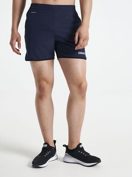 Craft Szorty sportowe "Pro Control Impact" w kolorze granatowym rozmiar: XL. Niebieskie krótkie spodenki sportowe Craft, xl, bez wzorów, z materiału. Za 121.35 zł.