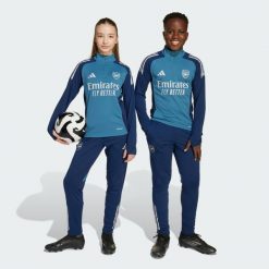 Spodnie treningowe Arsenal Tiro 25 Competition. Niebieskie spodnie treningowe długie Adidas, bez wzorów, z dresówki. Za 259.00 zł.