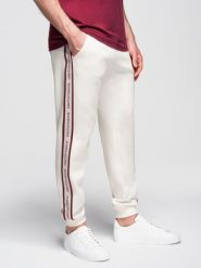 Sportowe spodnie męskie jogger z lampasami – kremowe V2. Białe joggery i bojówki Ombre Clothing, m, bez wzorów, z bawełny. Za 219.99 zł.