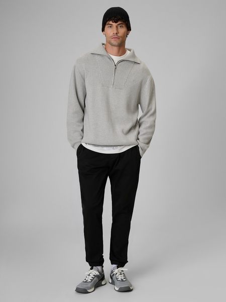 4F Spodnie casual joggery męskie - czarne L. Czarne joggery i bojówki 4F, l, bez wzorów, z bawełny, casualowe, z standardowym stanem. Za 179.99 zł.