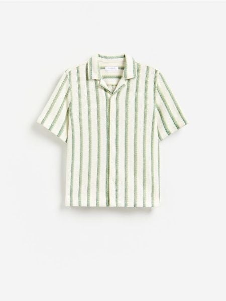 Ażurowa koszula regular - kremowy. Białe koszule Reserved, l, w ażurowe wzory, z bawełny, bez kołnierzyka, bez ramiączek. Za 149.99 zł.