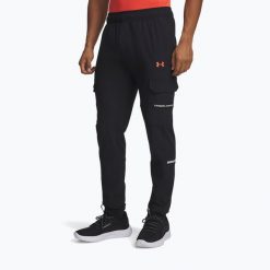 Spodnie treningowe męskie Under Armour Tech Utility Woven. Czarne buty treningowe Under Armour, bez wzorów, na fitness i siłownię. Za 239.99 zł.