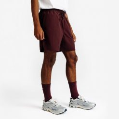Spodenki męskie Elementals. Fioletowe krótkie spodenki sportowe Decathlon, l, bez wzorów, z materiału. Za 79.99 zł.