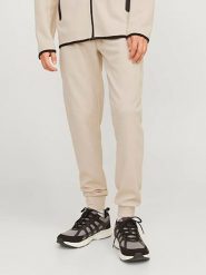 Jack & Jones Spodnie dresowe w kolorze kremowym rozmiar: S. Brązowe spodnie treningowe długie Jack & Jones, s, bez wzorów, z dresówki. Za 92.42 zł.
