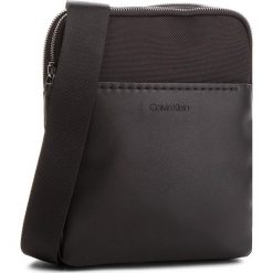 Saszetka CALVIN KLEIN - Multi Task Flat Cros K50K503775 001. Czarne saszetki i nerki marki CALVIN KLEIN, z materiału. Za 349.00 zł.
