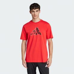 Koszulka Logo Graphic. Białe t-shirty sportowe Adidas, bez wzorów, bez ramiączek, na fitness i siłownię. Za 129.00 zł.
