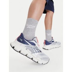 Buty do biegania Reebok. Białe buty do biegania Reebok, bez wzorów, bez zapięcia, do biegania. Za 489.99 zł.