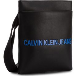 Saszetka CALVIN KLEIN JEANS - Smooth Flat Pack K40K400373 001. Saszetki i nerki marki Calvin Klein Jeans. W wyprzedaży za 269.00 zł.