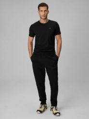 4F Spodnie dresowe męskie - czarne L. Czarne spodnie materiałowe 4F, na co dzień, l, bez wzorów, z dresówki, sportowe. Za 159.99 zł.