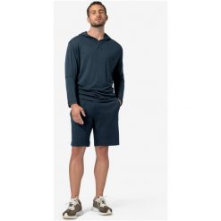 Spodenki dresowe męskie SUPER.NATURAL Solution Shorts. Niebieskie krótkie spodenki sportowe super.natural, m, bez wzorów, z dresówki. Za 429.99 zł.