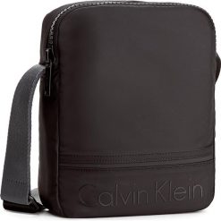 Saszetka CALVIN KLEIN - Matthew Reporter K50K502899 001. Saszetki i nerki marki CALVIN KLEIN. W wyprzedaży za 219.00 zł.