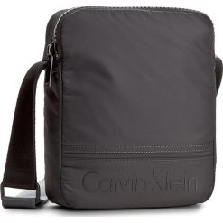 Saszetka CALVIN KLEIN - Matthew Reporter K50K502899 009. Saszetki i nerki marki CALVIN KLEIN. W wyprzedaży za 219.00 zł.