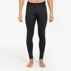 Legginsy termiczne do piłki nożnej Kipsta Keepcomfort 100. Czarne legginsy długie sportowe KIPSTA, m, bez wzorów, z elastanu, do koszykówki. Za 64.99 zł.
