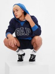 BLUZA MĘSKA DRESOWA Z KAPTUREM GAP VINTAGE SOFT LOGO KOLOR NIEBIESKI. Niebieskie bluzy z kapturem GAP, l, bez wzorów, z bawełny, z kapturem. Za 151.50 zł.