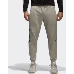 Adidas Spodnie męskie Zne Striker beżowe r. M (CW0140). Spodnie treningowe długie Adidas. Za 248.70 zł.