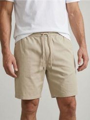 Bawełniane szorty jogger - beżowy. Brązowe krótkie spodenki sportowe Sinsay, l, bez wzorów, z bawełny. W wyprzedaży za 29.99 zł.
