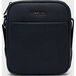 Calvin Klein - Saszetka. Czarne saszetki i nerki CALVIN KLEIN, bez wzorów, małe, bez dodatków. Za 269.90 zł.