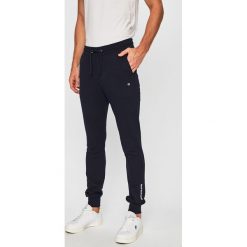 Calvin Klein Jeans - Spodnie. Niebieskie spodnie materiałowe Calvin Klein Jeans, bez wzorów, z bawełny, casualowe. Za 359.90 zł.