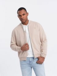Lekka kurtka męska bomberka z logowaną podszewką - jasnobeżowa V2 - Rozmiar: L. Brązowe kurtki Ombre Clothing, l, z aplikacjami, z bawełny, bez kaptura. W wyprzedaży za 119.99 zł.