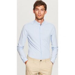 Koszula ze stójką super slim fit - Niebieski. Koszule marki Under Armour. W wyprzedaży za 59.99 zł.