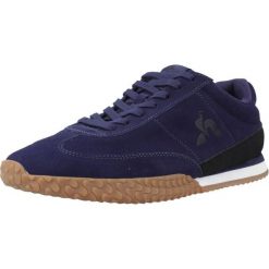 Buty LE COQ SPORTIF VELOCE I Niebieski. Niebieskie buty trekkingowe le coq sportif, bez wzorów, z tkaniny, bez zapięcia, trekkingowe. W wyprzedaży za 327.25 zł.