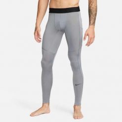 Legginsy męskie Nike Dri-FIT Fitness Tights. Szare legginsy długie sportowe Nike, m, bez wzorów, z poliesteru, na fitness i siłownię, dri-fit (nike). Za 188.50 zł.