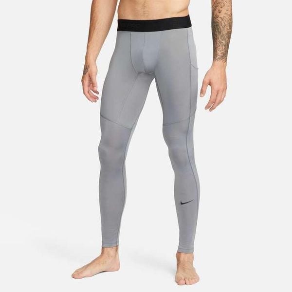 Legginsy męskie Nike Dri-FIT Fitness Tights. Szare legginsy długie sportowe Nike, m, bez wzorów, z poliesteru, na fitness i siłownię, dri-fit (nike). Za 188.50 zł.